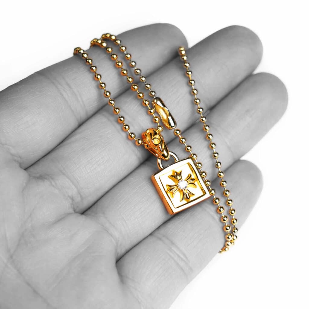 22K GOLD FLAMED PLUS CHARM WITH DIAMONDS